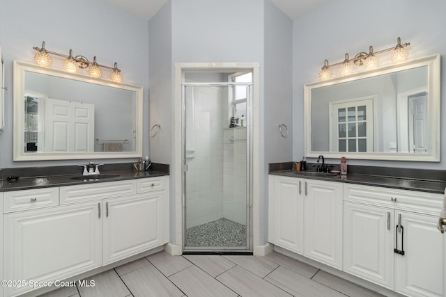439 Gardendale Cir SE, Palm Bay, FL 32909 - full bath with two vanities, a stall shower, and a sink