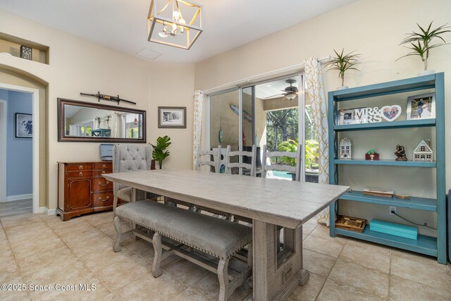 439 Gardendale Cir SE, Palm Bay, FL 32909 - dining room featuring tile patterned flooring and a chandelier