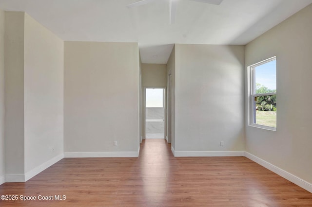 2742 Fling Ave SE, Palm Bay, FL 32909 - empty room with light wood-type flooring, baseboards, and ceiling fan
