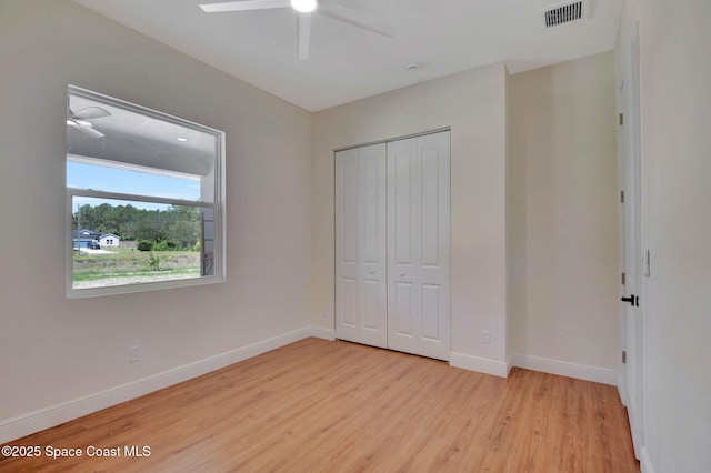 2742 Fling Ave SE, Palm Bay, FL 32909 - unfurnished bedroom featuring baseboards, light wood-style flooring, visible vents, and a closet