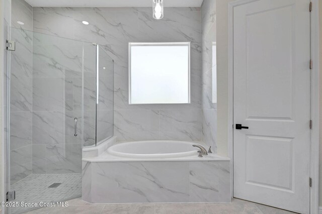2742 Fling Ave SE, Palm Bay, FL 32909 - bathroom with a garden tub, tile patterned flooring, and a marble finish shower