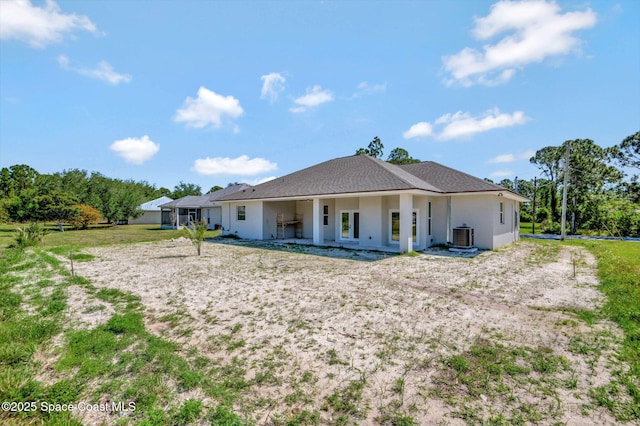 2742 Fling Ave SE, Palm Bay, FL 32909 - back of property featuring central AC and stucco siding