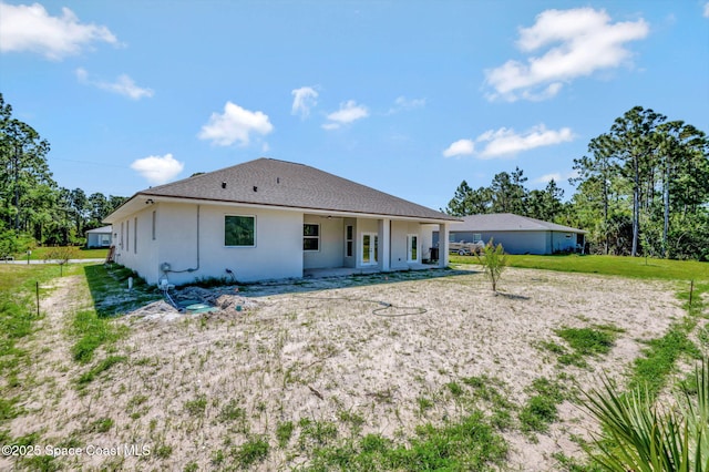 2742 Fling Ave SE, Palm Bay, FL 32909 - rear view of property with a patio and stucco siding