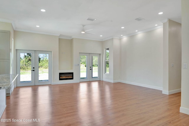2742 Fling Ave SE, Palm Bay, FL 32909 - unfurnished living room with recessed lighting, light wood finished floors, visible vents, a ceiling fan, and french doors