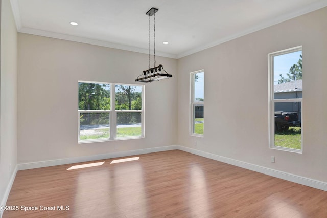 2742 Fling Ave SE, Palm Bay, FL 32909 - unfurnished dining area with baseboards, wood finished floors, recessed lighting, and crown molding