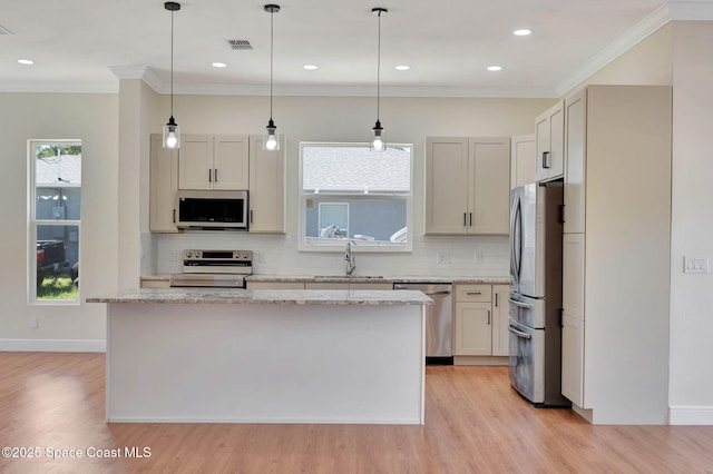 2742 Fling Ave SE, Palm Bay, FL 32909 - kitchen with light wood-type flooring, stainless steel appliances, visible vents, and a sink