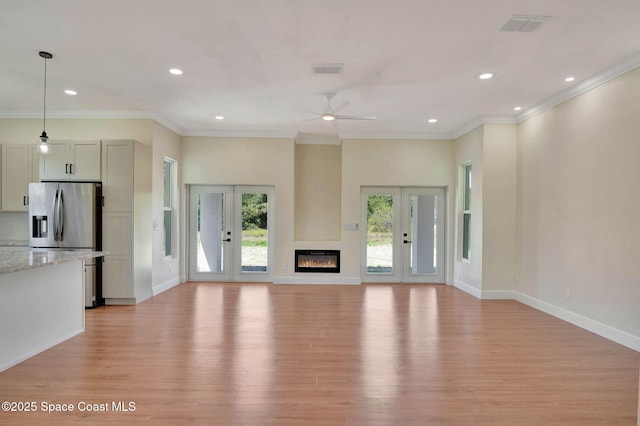 2742 Fling Ave SE, Palm Bay, FL 32909 - unfurnished living room featuring recessed lighting, visible vents, and light wood-style flooring