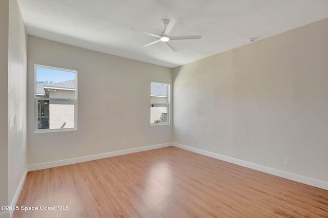 2742 Fling Ave SE, Palm Bay, FL 32909 - unfurnished room with baseboards, a ceiling fan, and light wood finished floors