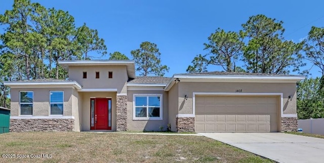prairie-style home with a garage, driveway, stone siding, a front yard, and stucco siding