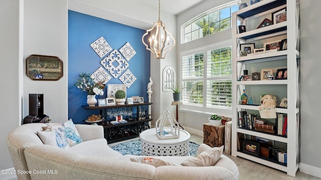 3630 Kite St, Titusville, FL 32796 - living area featuring baseboards and an inviting chandelier