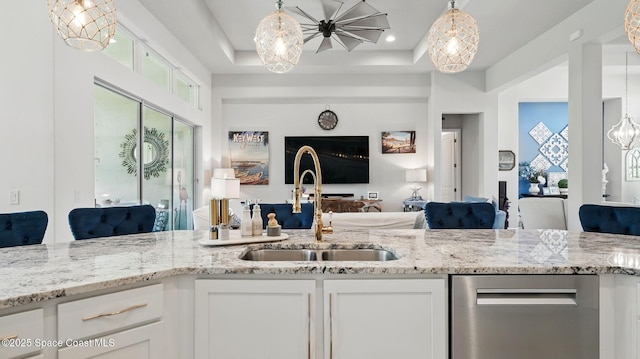 3630 Kite St, Titusville, FL 32796 - interior space featuring plenty of natural light, hanging light fixtures, a sink, and a raised ceiling