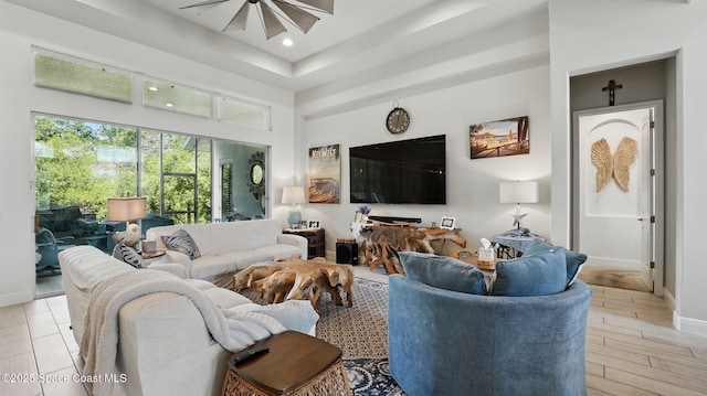 3630 Kite St, Titusville, FL 32796 - living room featuring recessed lighting, a high ceiling, a ceiling fan, light wood-style floors, and baseboards