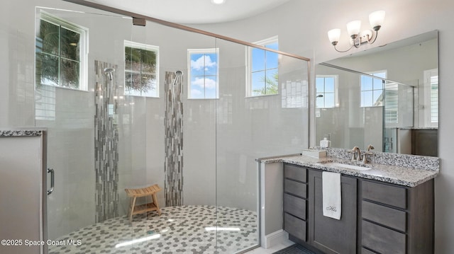 3630 Kite St, Titusville, FL 32796 - full bathroom with a shower stall, vanity, and an inviting chandelier