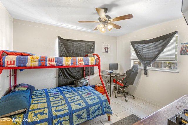tiled bedroom with ceiling fan