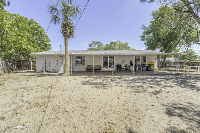 back of property with fence