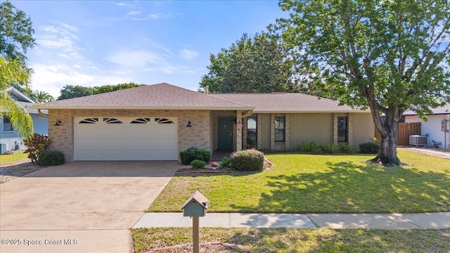 2873 Sanders Ct, Melbourne, FL 32935 - single story home featuring concrete driveway, a front lawn, an attached garage, cooling unit, and brick siding
