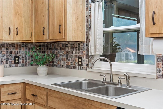 2873 Sanders Ct, Melbourne, FL 32935 - kitchen with tasteful backsplash, a sink, and light countertops