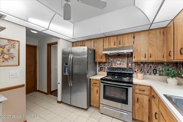2873 Sanders Ct, Melbourne, FL 32935 - kitchen with backsplash, electric stove, under cabinet range hood, and stainless steel fridge with ice dispenser