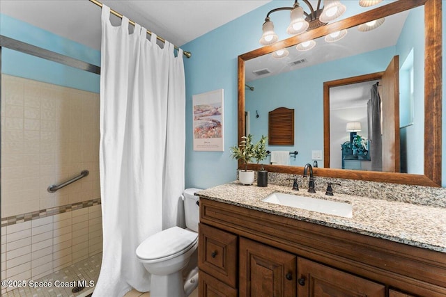 2873 Sanders Ct, Melbourne, FL 32935 - full bath with visible vents, a tile shower, vanity, and toilet