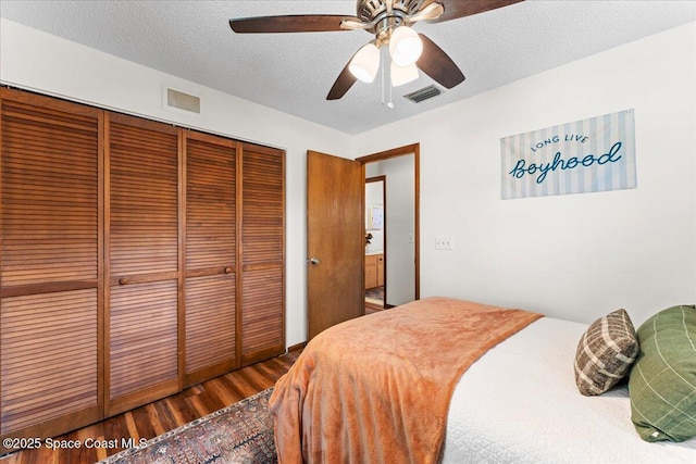 2873 Sanders Ct, Melbourne, FL 32935 - bedroom with wood finished floors, a closet, ceiling fan, and visible vents