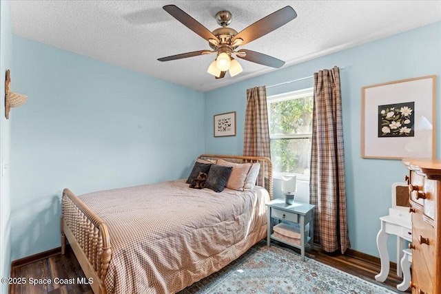 2873 Sanders Ct, Melbourne, FL 32935 - bedroom with baseboards, a ceiling fan, wood finished floors, and a textured ceiling