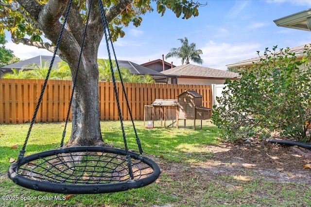 2873 Sanders Ct, Melbourne, FL 32935 - view of yard featuring a fenced backyard
