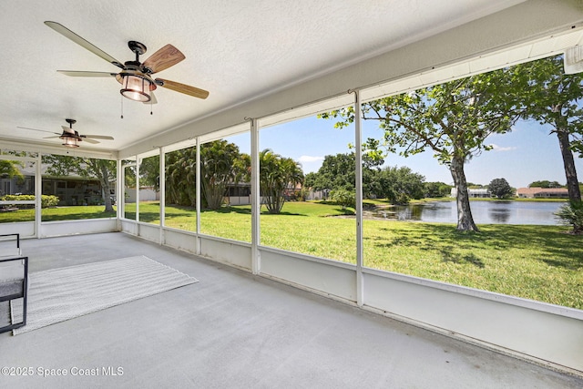 3360 Holly Springs Rd, Melbourne, FL 32934 - unfurnished sunroom featuring a water view, ceiling fan, and a healthy amount of sunlight