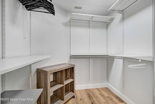3360 Holly Springs Rd, Melbourne, FL 32934 - walk in closet featuring light wood-style flooring and visible vents