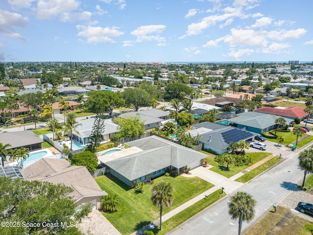 birds eye view of property with a residential view