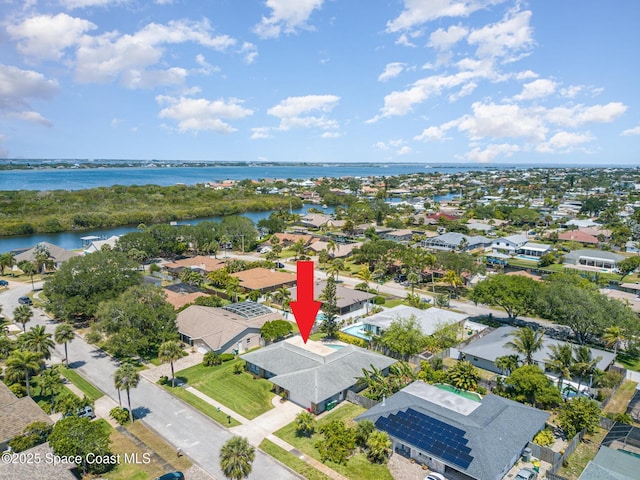 bird's eye view with a residential view and a water view