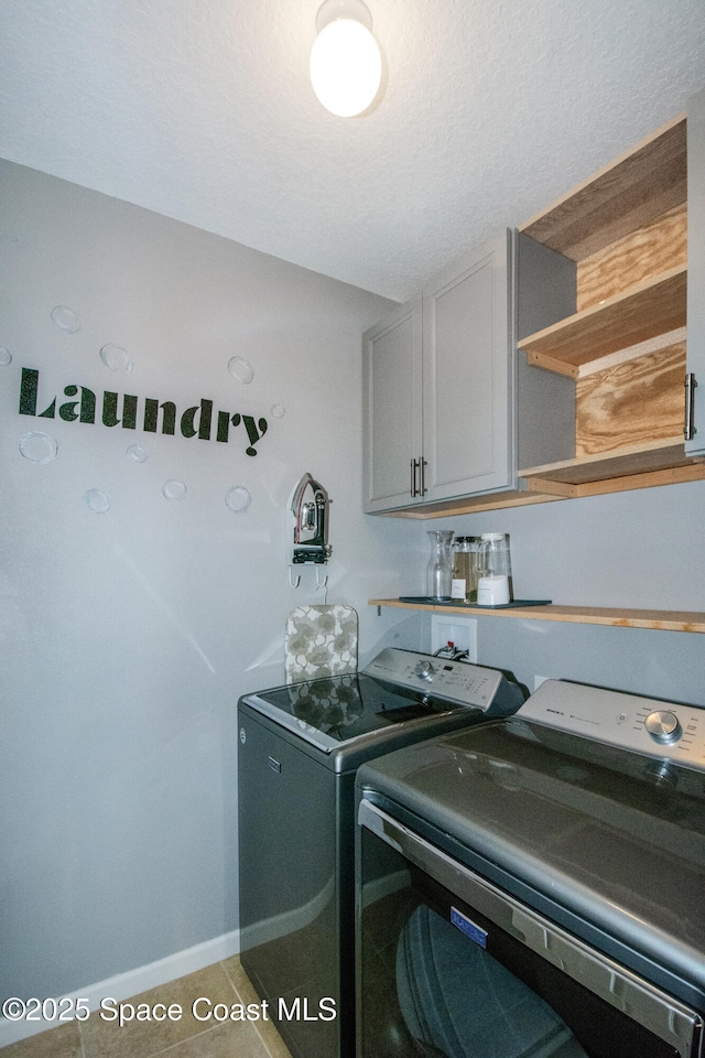 264 Moray Dr SW, Palm Bay, FL 32908 - laundry room with cabinet space, baseboards, and separate washer and dryer