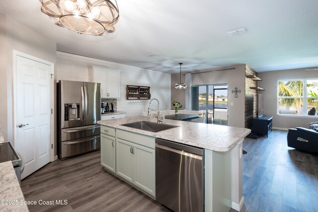 264 Moray Dr SW, Palm Bay, FL 32908 - kitchen featuring appliances with stainless steel finishes, a chandelier, a sink, and light countertops
