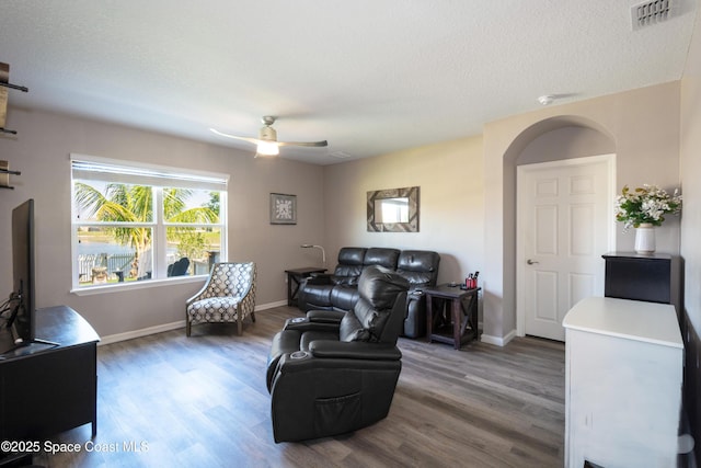 264 Moray Dr SW, Palm Bay, FL 32908 - living area with a ceiling fan, wood finished floors, and visible vents