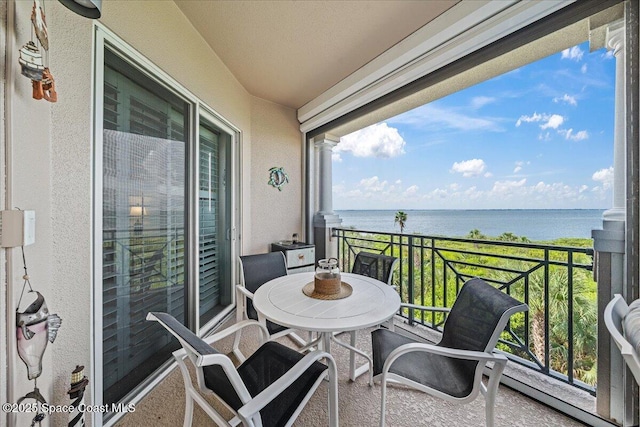 balcony featuring a water view