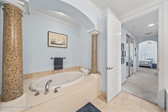 bathroom with a jetted tub, visible vents, ornamental molding, connected bathroom, and decorative columns