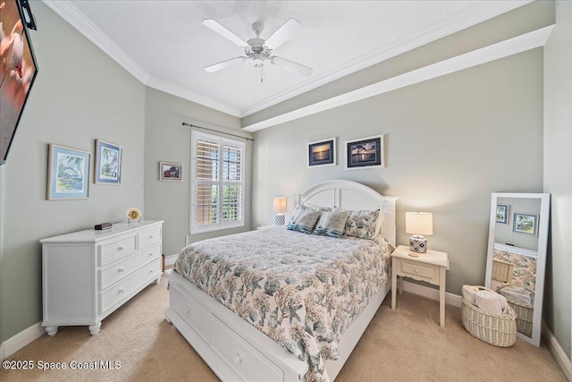 bedroom featuring ceiling fan, baseboards, light colored carpet, and crown molding