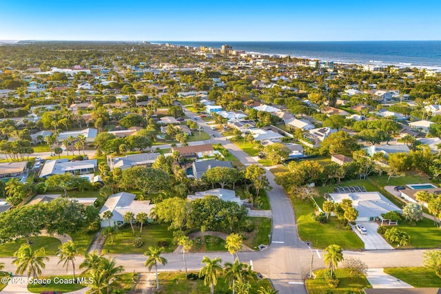 birds eye view of property with a water view and a residential view
