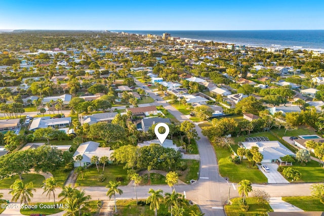 drone / aerial view featuring a residential view and a water view