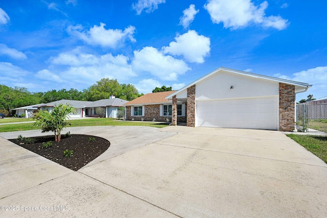 ranch-style house featuring a front lawn, an attached garage, curved driveway, and fence