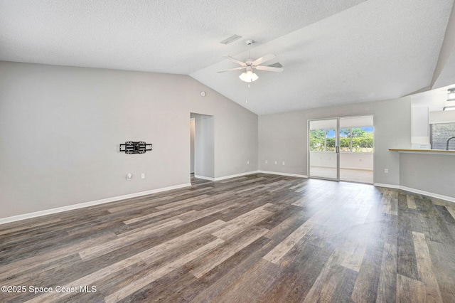 unfurnished living room with dark wood-style floors, ceiling fan, visible vents, a textured ceiling, and lofted ceiling