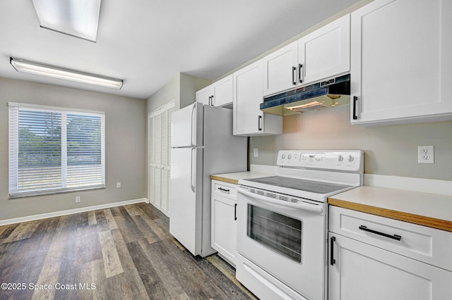 kitchen featuring dark wood-style floors, white cabinets, under cabinet range hood, and white appliances