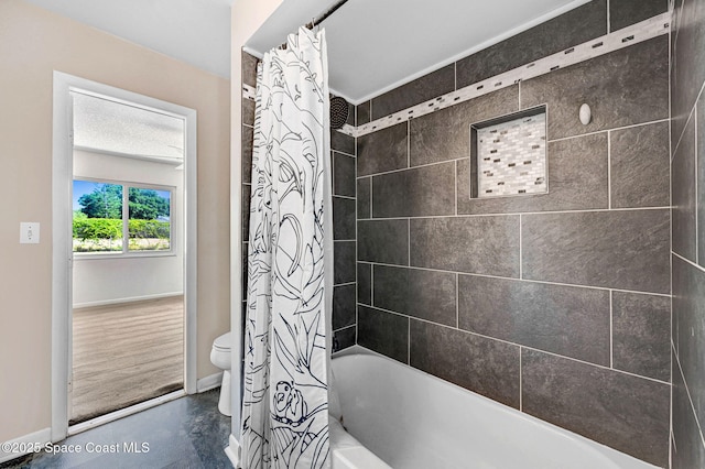 full bath with toilet, concrete flooring, shower / tub combo, and baseboards