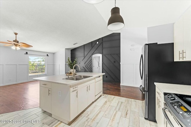 194 Saybrook Rd SW, Palm Bay, FL 32908 - kitchen featuring stainless steel electric range oven, light wood-style flooring, a sink, and a decorative wall
