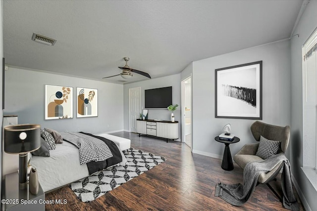 194 Saybrook Rd SW, Palm Bay, FL 32908 - bedroom featuring baseboards, visible vents, wood finished floors, ceiling fan, and connected bathroom
