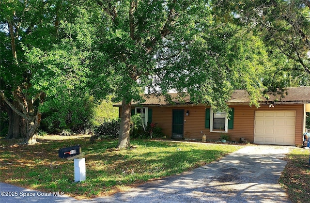 single story home with concrete driveway, an attached garage, and a front lawn