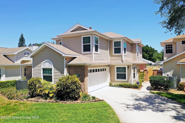view of front of property featuring central air condition unit, driveway, an attached garage, fence, and brick siding