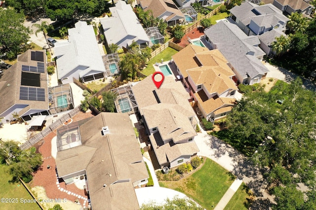 birds eye view of property with a residential view