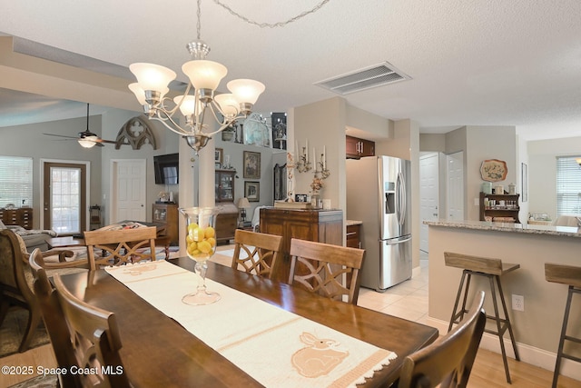dining room with visible vents and ceiling fan with notable chandelier