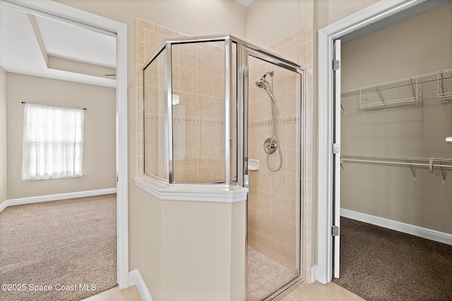 1298 Etruscan Way Unit 119, Indian Harbour Beach, FL 32937 - bathroom with a shower stall, a spacious closet, and baseboards