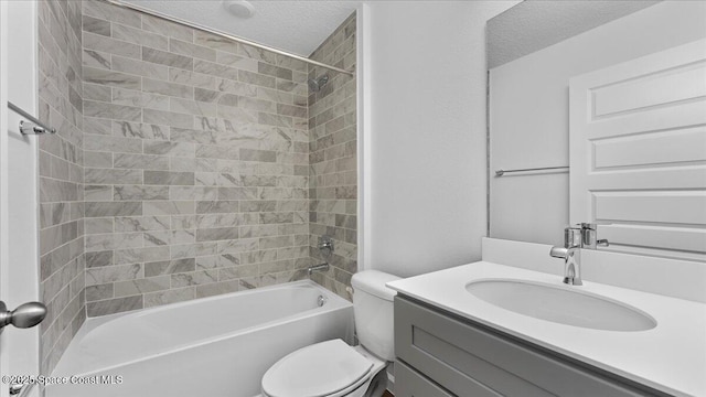 full bath featuring shower / bathing tub combination, vanity, a textured ceiling, and toilet